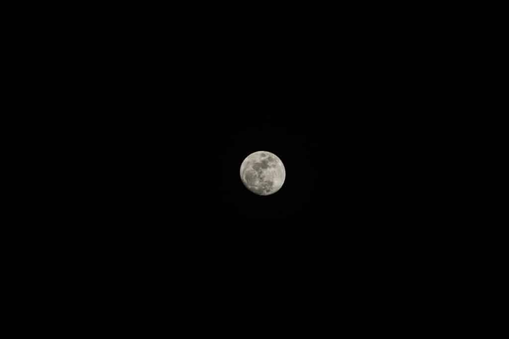 Indian-Wedding-in-Maui-_0045 - Ann Arbor Wedding Photographer Full moon with craters visible, centered toward the bottom of a dark night sky